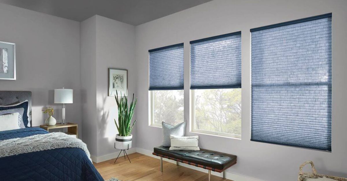 Bedroom with clean cellular shades offering privacy and natural light control